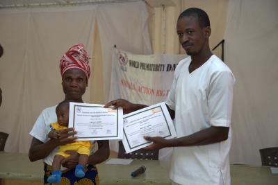 a twin mother of PIH Liberia kangaroo mother care program receives certificate of appreciation