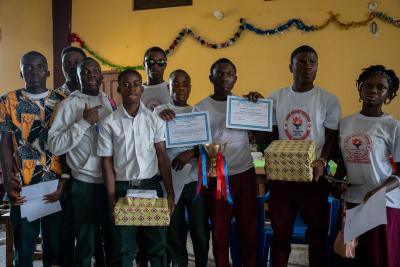 Members of the John Hilary Tubman High School quizzing team display their gifts and certificates at the end of the competition. Photo by Ansumana O. Sesay / PIH
