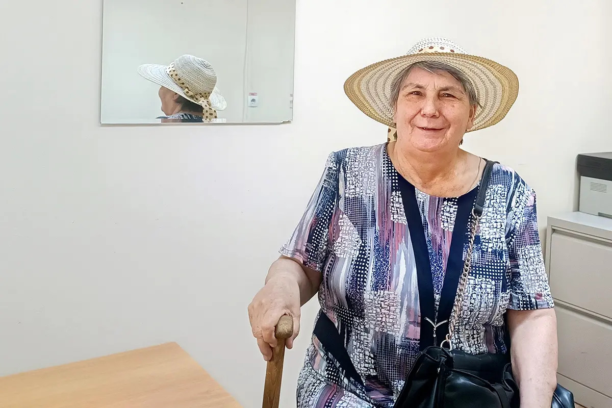 A woman patient smiling at the camera