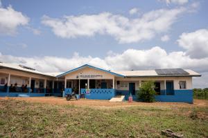 Partial front view of Edith Wallace Health Center showing mounted solar panels for backup electricity.