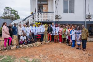 Resident doctors, PIHers and Maryland County Health Team staff pose for group photo at the end of the family medicine residency program white coat ceremony.