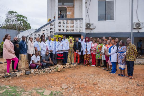 Resident doctors, PIHers and Maryland County Health Team staff pose for group photo at the end of the family medicine residency program white coat ceremony.