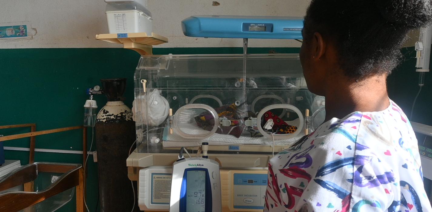a young baby delivered at JJ Dossen Hospital receives care in an incubator