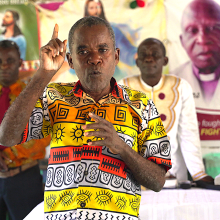 Anthony Toe, who receives mental health support from Partners In health, preaches at his church outside Harper 
