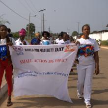 Kangaroo Mother Care (KMC) mothers, guardians and other relatives parade in Harper, Liberia, upon completion of the 2024 KMC program cycle. Photo by Ansumana Sesay / PIH