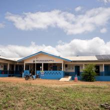 Partial front view of Edith Wallace Health Center showing mounted solar panels for backup electricity.