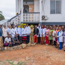 Resident doctors, PIHers and Maryland County Health Team staff pose for group photo at the end of the family medicine residency program white coat ceremony.