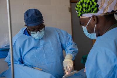 Dr. Sterman Toussaint (left), Partners In Health Chief Medical Officer and Intern Doctor Siafa H. Rogers (Right), performing a surgery at the James Jenkins Dossen Memorial Hospital in Harper.