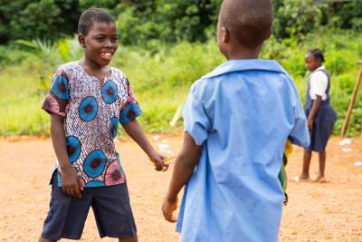 Dennis Toe (center) plays with his schoolmates during recess at the Dokliken Public School in Maryland County, Liberia. 