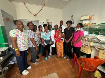 Mother with nurses and doctors. 
